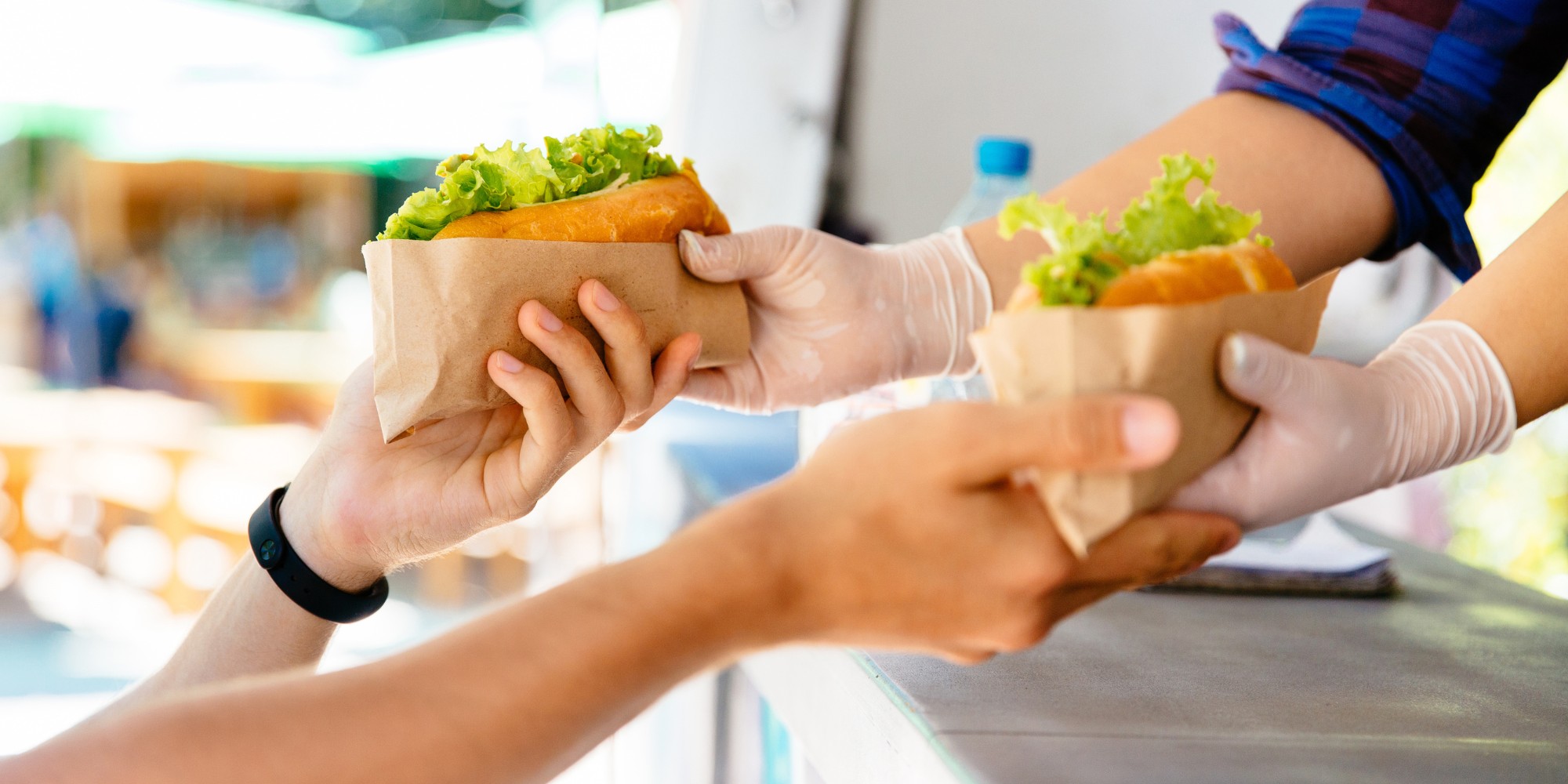 Buying sandwiches with cash from Hawaii's best ATM services provider